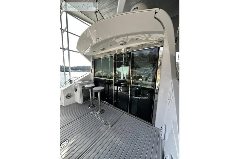 Slide: The Image of 2022 Cruisers Yachts 60 Cantius deck with sleek design and modern seating. - 56
