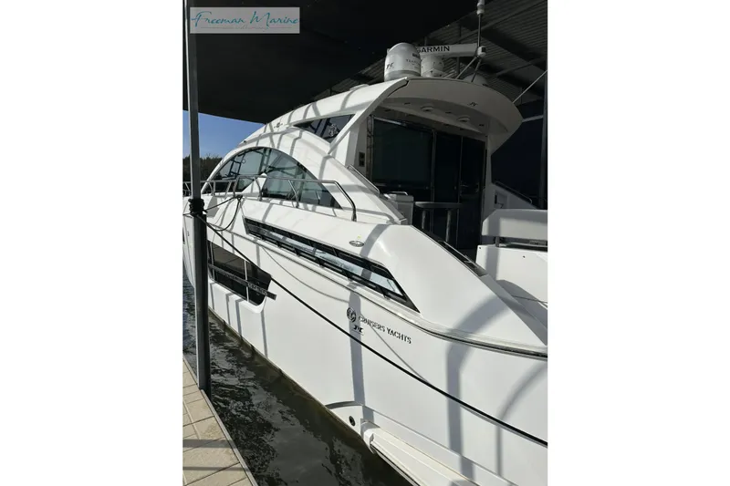 Slide: The Image of 2022 Cruisers Yachts 60 Cantius docked, showcasing sleek design and modern features. - 69