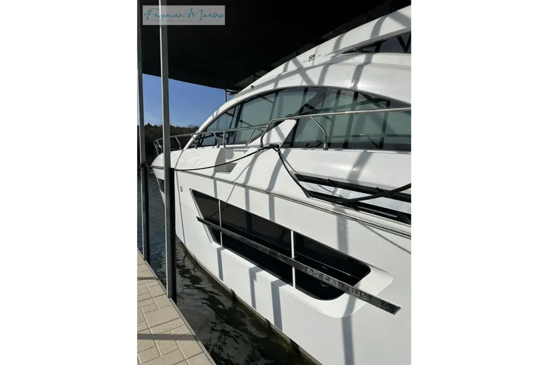 Slide: The Image of 2022 Cruisers Yachts 60 Cantius docked, showcasing sleek design and modern features. - 70