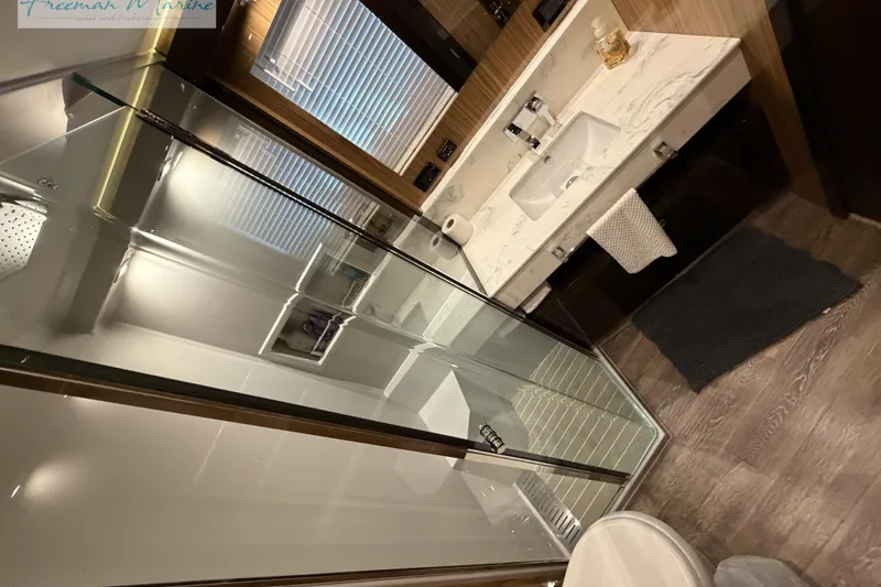 Slide: The Image of Luxurious bathroom interior of 2022 Cruisers Yachts 60 Cantius with modern fixtures. - 76
