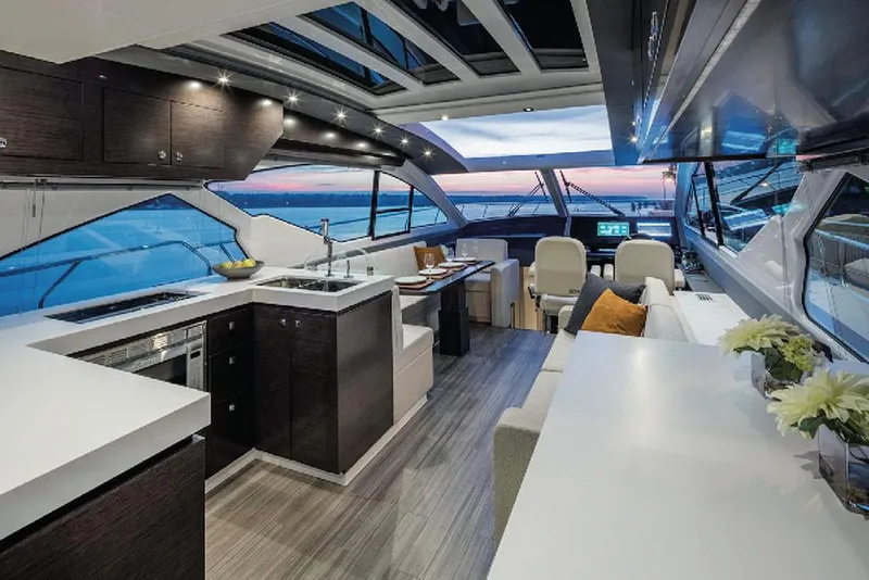 Slide: The Image of Manufacturer Provided Image: Luxurious interior of 2022 Cruisers Yachts 60 Cantius with modern kitchen and seating area. - 8