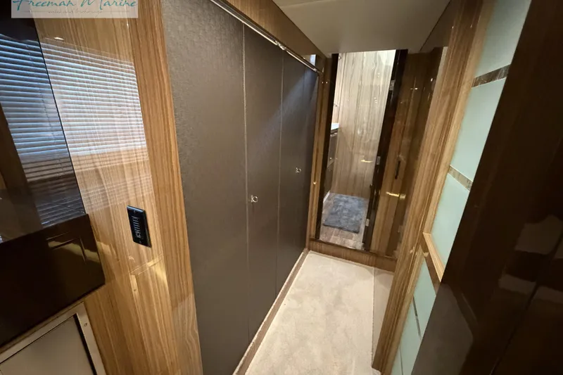 Slide: The Image of Luxurious interior hallway of 2022 Cruisers Yachts 60 Cantius, featuring elegant wood finishes. - 82
