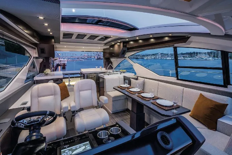Slide: The Image of Manufacturer Provided Image: Luxurious interior of 2022 Cruisers Yachts 60 Cantius with waterfront view. - 10