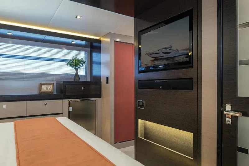 Slide: The Image of Manufacturer Provided Image: Luxurious bedroom interior of 2022 Cruisers Yachts 60 Cantius with modern decor and TV. - 16