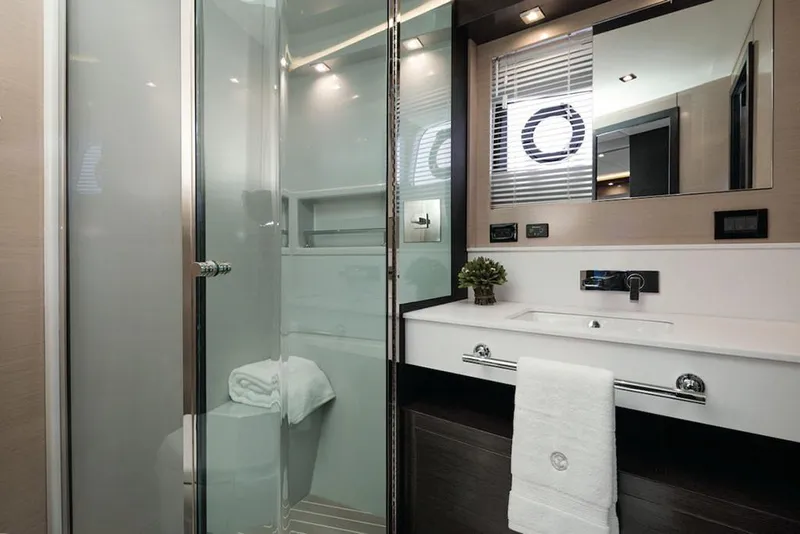 Slide: The Image of Manufacturer Provided Image: Modern bathroom in 2022 Cruisers Yachts 60 Cantius with glass shower and sleek vanity. - 22