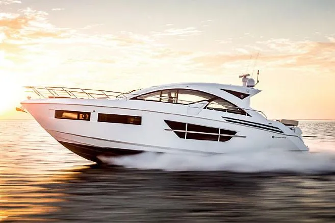 Slide: The Image of Manufacturer Provided Image: 2022 Cruisers Yachts 60 Cantius cruising at sunset on open water. - 3