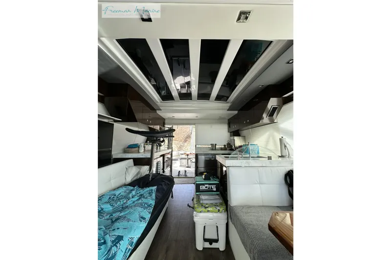 Slide: The Image of Luxurious interior of 2022 Cruisers Yachts 60 Cantius with modern kitchen and seating area. - 39