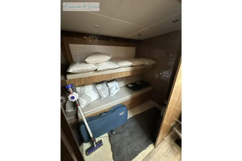 Slide: The Image of 2022 Cruisers Yachts 60 Cantius cabin with bunk beds and modern decor. - 41