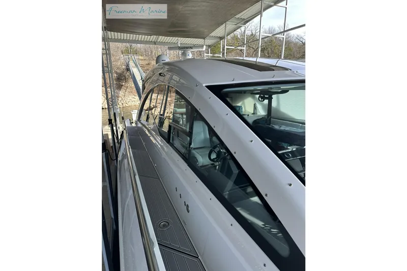 Slide: The Image of 2022 Cruisers Yachts 60 Cantius docked, showcasing sleek design and modern features. - 49