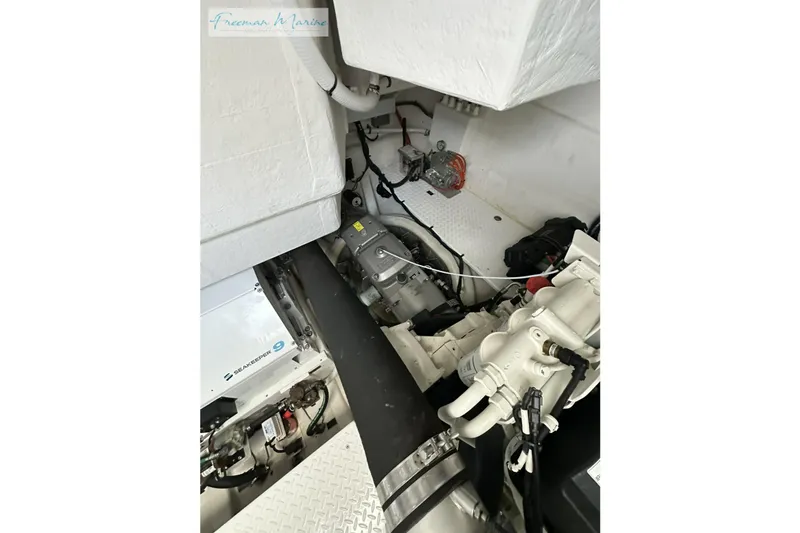 Slide: The Image of Engine room of 2022 Cruisers Yachts 60 Cantius, showcasing mechanical components and systems. - 63