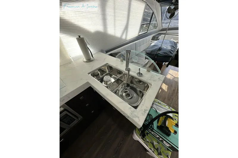 Slide: The Image of Luxurious 2022 Cruisers Yachts 60 Cantius kitchen with modern sink and sleek countertop design. - 84