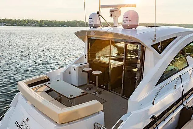 Slide: The Image of Manufacturer Provided Image: 2022 Cruisers Yachts 60 Cantius luxury yacht on water at sunset. - 85