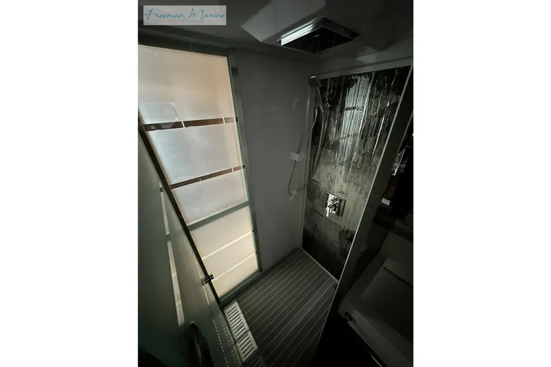Slide: The Image of Luxurious shower interior of 2022 Cruisers Yachts 60 Cantius with modern design. - 88
