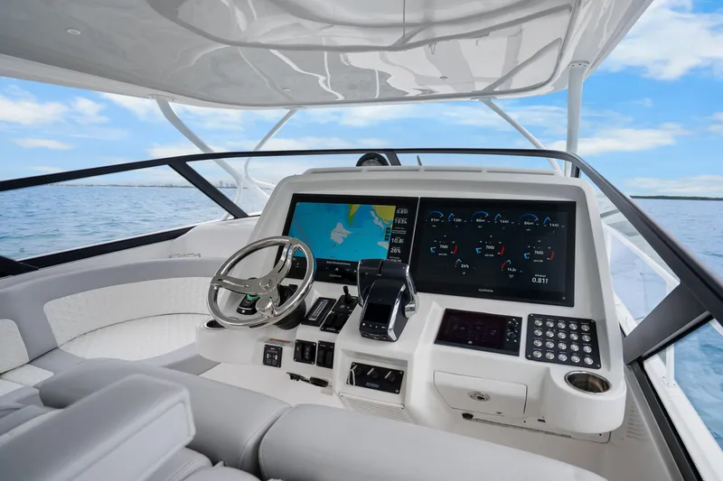 Slide: The Image of 2024 Intrepid 477 Evolution boat dashboard with advanced navigation and control systems. - 10