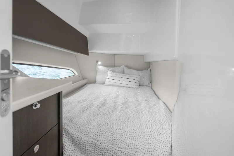 Slide: The Image of Luxurious cabin interior of 2024 Intrepid 477 Evolution yacht with cozy bedding. - 14