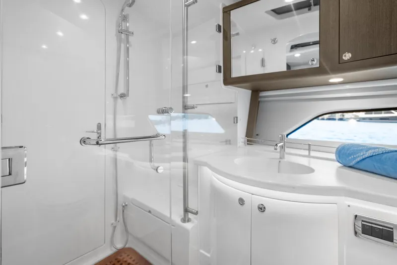 Slide: The Image of Luxurious bathroom interior of 2024 Intrepid 477 Evolution yacht with modern fixtures. - 16