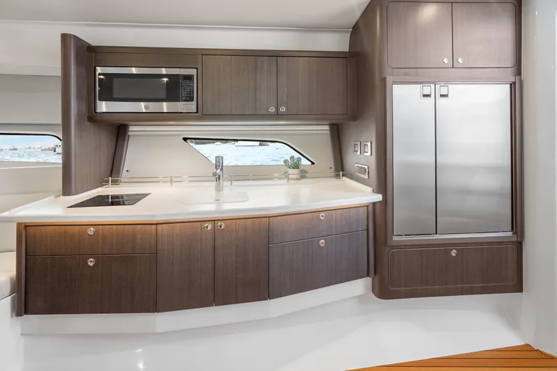 Slide: The Image of Luxurious kitchen interior of 2024 Intrepid 477 Evolution yacht with modern appliances. - 19