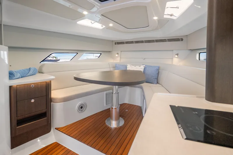 Slide: The Image of Luxurious interior of 2024 Intrepid 477 Evolution yacht with elegant seating and modern design. - 21