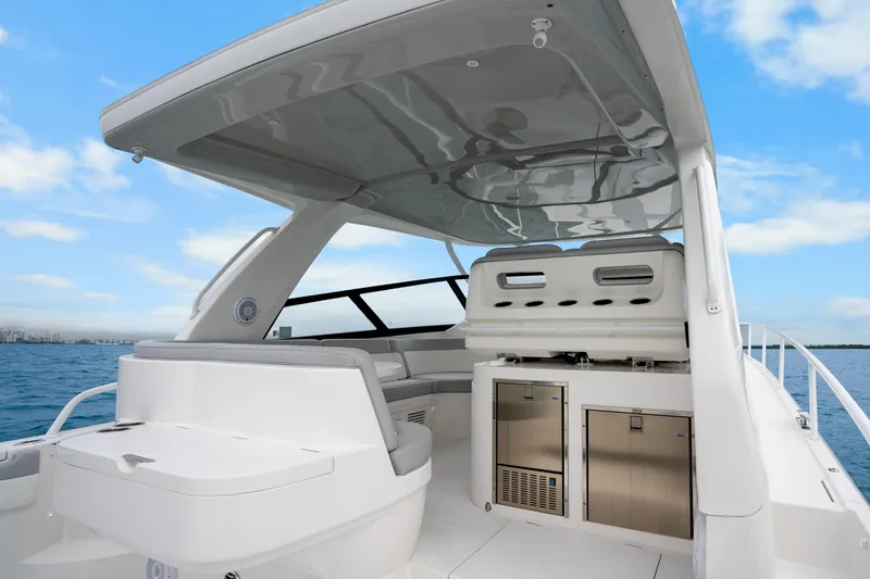 Slide: The Image of 2024 Intrepid 477 Evolution boat interior with sleek design and modern amenities. - 23