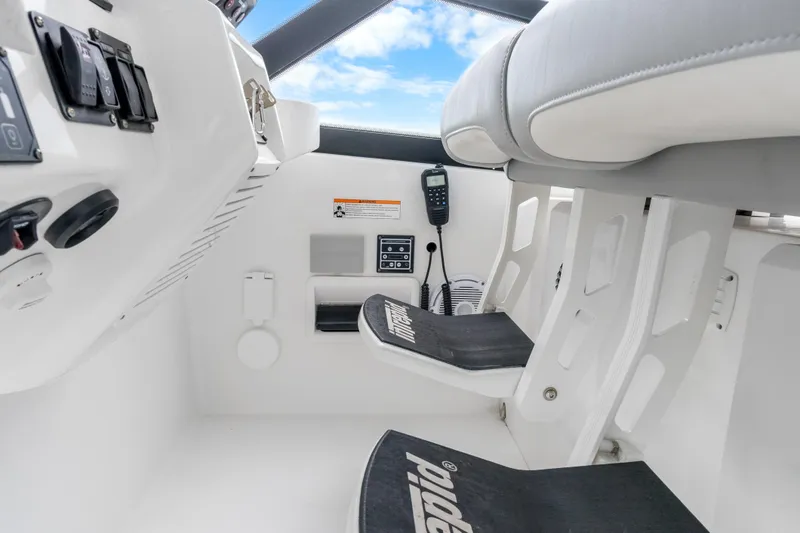 Slide: The Image of 2024 Intrepid 477 Evolution helm with controls and seating, featuring modern design elements. - 38