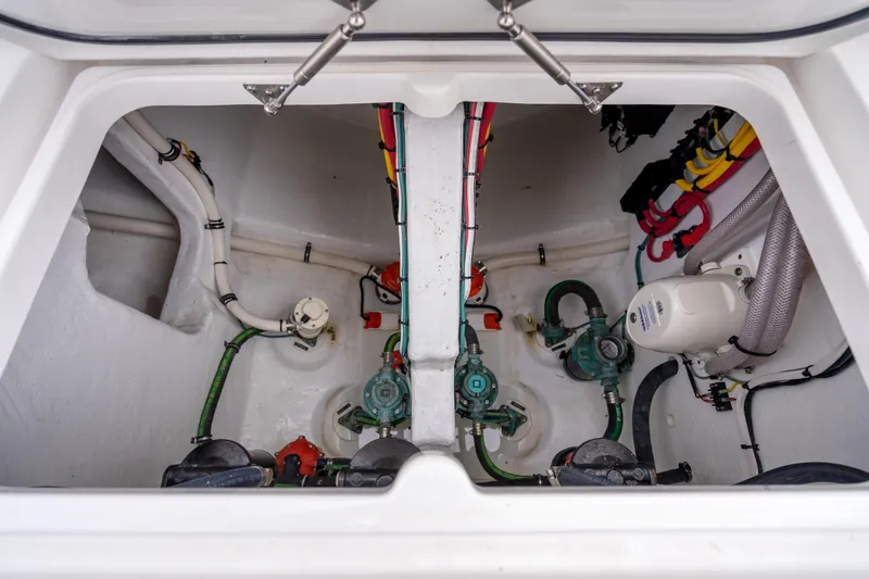 Slide: The Image of 2024 Intrepid 477 Evolution engine compartment with visible wiring and plumbing systems. - 40