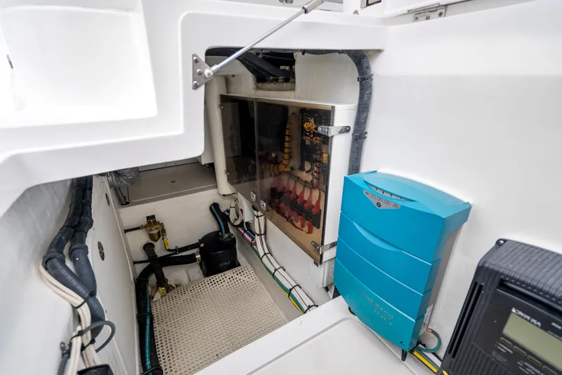 Slide: The Image of Engine room of 2024 Intrepid 477 Evolution boat, showcasing electrical systems and components. - 41