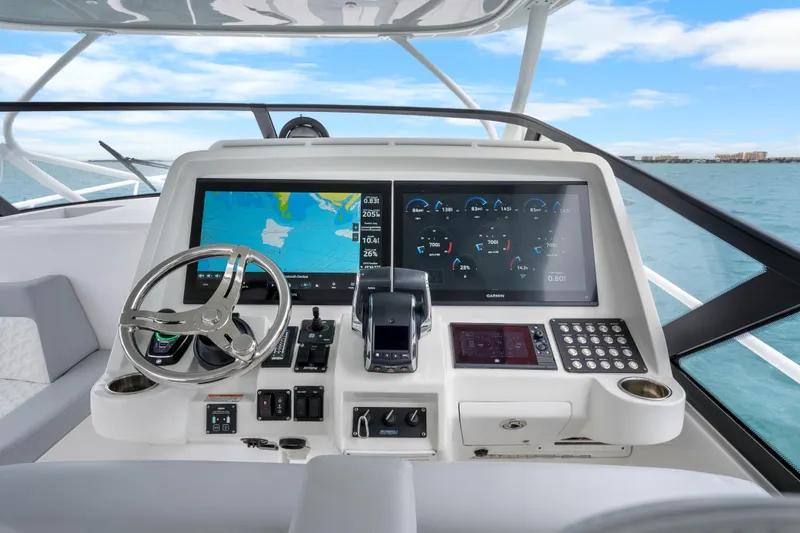 Slide: The Image of 2024 Intrepid 477 Evolution helm with advanced navigation and control systems. - 8