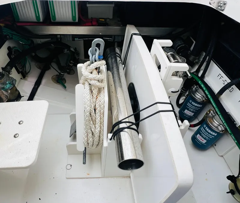 Slide: The Image of 2022 Pursuit S 358 Sport boat storage area with ropes and equipment. - 14