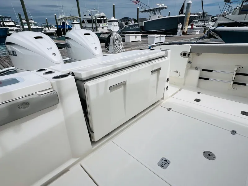 Slide: The Image of 2022 Pursuit S 358 Sport boat deck with Yamaha engines at marina. - 21