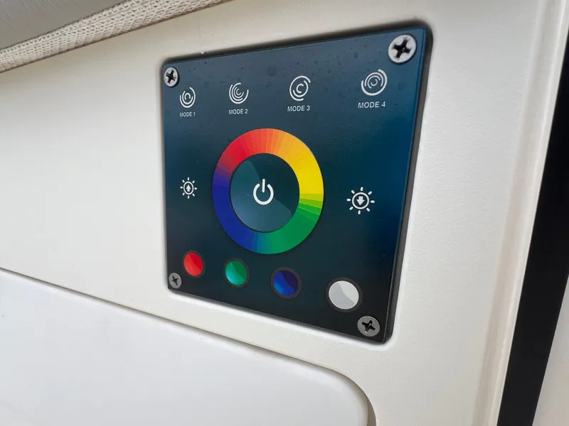 Slide: The Image of Control panel with colorful LED settings on 2022 Pursuit S 358 Sport boat. - 26