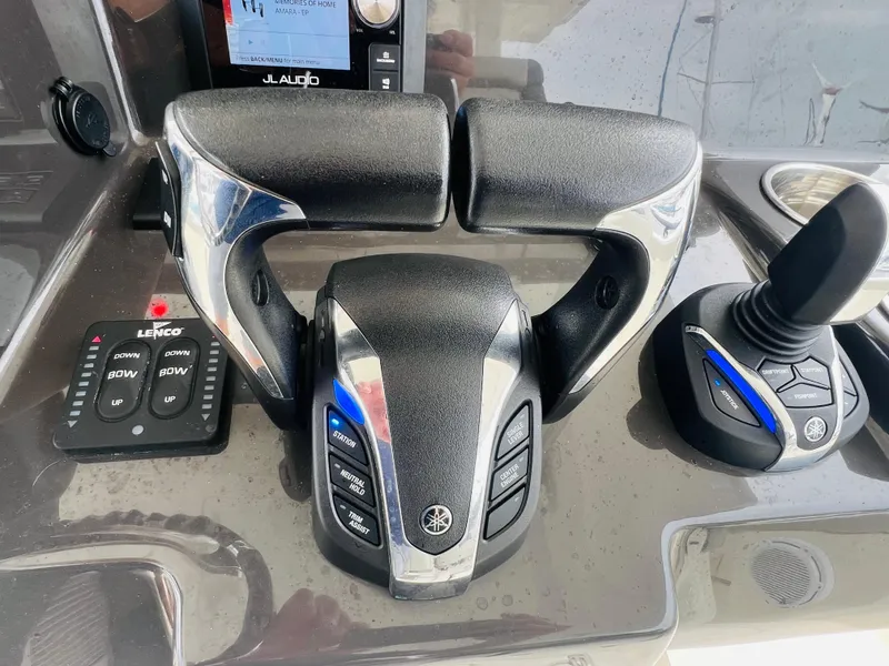 Slide: The Image of Close-up of 2022 Pursuit S 358 Sport boat controls and joystick. - 29