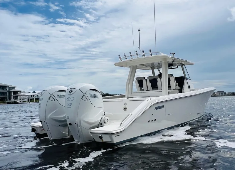 Slide: The Image of 2022 Pursuit S 358 Sport boat with twin Yamaha engines on open water. - 3
