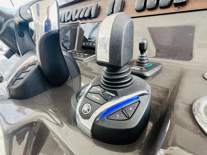 Slide: The Image of Close-up of 2022 Pursuit S 358 Sport boat controls and joystick. - 30