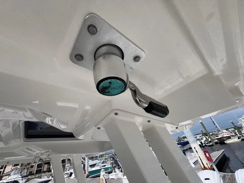 Slide: The Image of Close-up of a 2022 Pursuit S 358 Sport boat detail at a marina. - 8