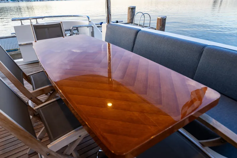 Slide: The Image of Luxurious outdoor dining area on 2017 Ocean Alexander 72 Pilothouse yacht. - 12