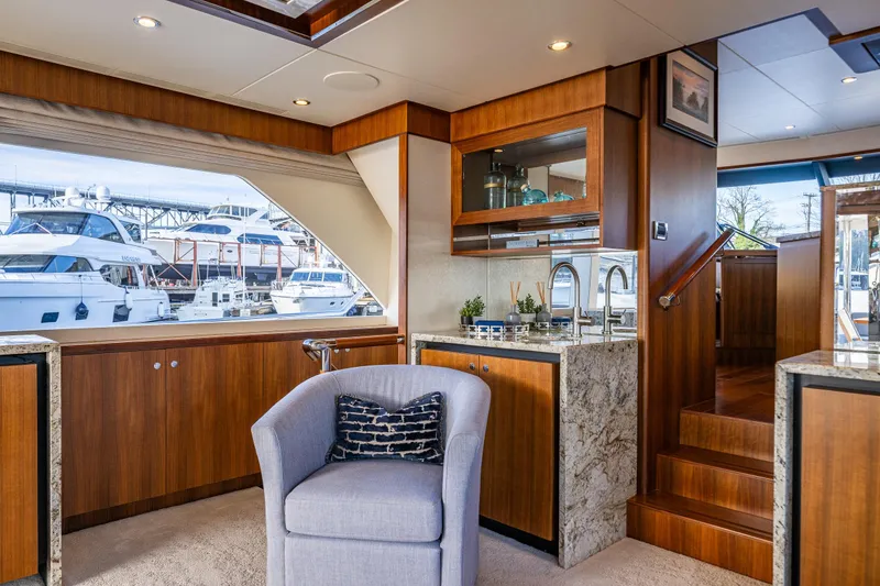 Slide: The Image of Luxurious interior of 2017 Ocean Alexander 72 Pilothouse yacht with elegant wood finishes. - 23