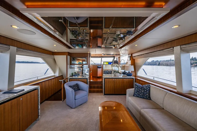 Slide: The Image of Luxurious interior of 2017 Ocean Alexander 72 Pilothouse yacht with elegant furnishings and panoramic windows. - 24