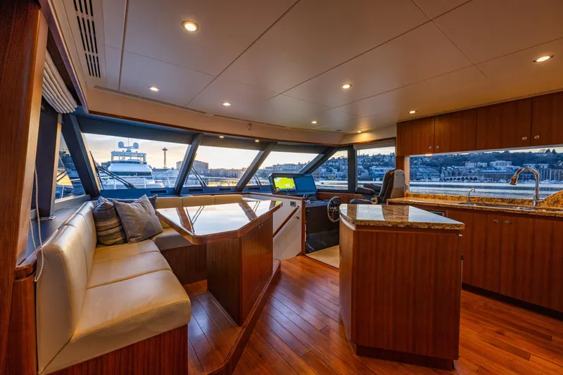 Slide: The Image of Luxurious interior of 2017 Ocean Alexander 72 Pilothouse yacht with panoramic windows and elegant furnishings. - 32