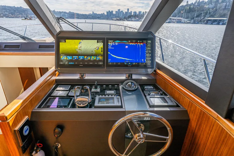 Slide: The Image of Pilothouse of 2017 Ocean Alexander 72, featuring advanced navigation displays and controls. - 33