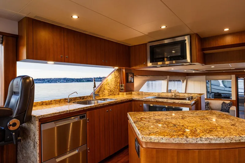 Slide: The Image of Luxurious 2017 Ocean Alexander 72 Pilothouse yacht kitchen with granite countertops and modern appliances. - 35