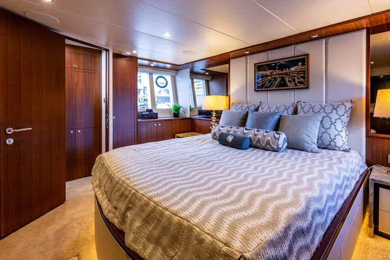 Slide: The Image of Luxurious bedroom interior of 2017 Ocean Alexander 72 Pilothouse yacht with elegant wood finishes. - 39