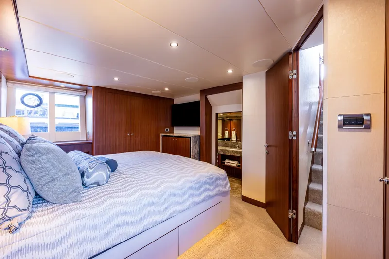 Slide: The Image of Luxurious bedroom interior of 2017 Ocean Alexander 72 Pilothouse yacht with elegant wood finishes. - 42