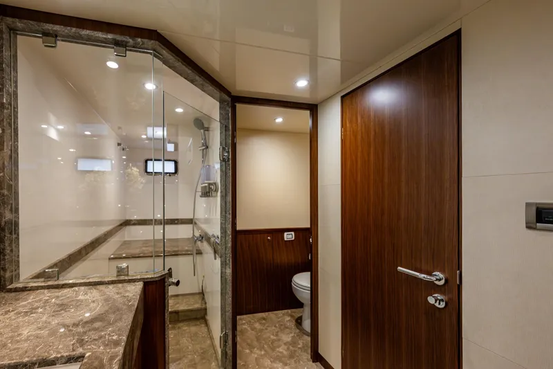 Slide: The Image of Luxurious bathroom in 2017 Ocean Alexander 72 Pilothouse yacht with marble and wood finishes. - 44