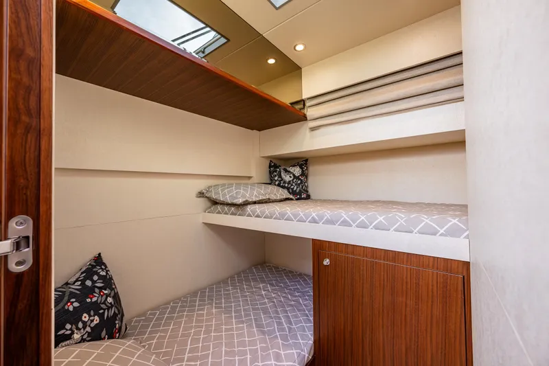 Slide: The Image of Bunk beds in 2017 Ocean Alexander 72 Pilothouse yacht cabin, featuring modern design and cozy decor. - 48