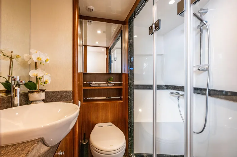 Slide: The Image of Luxurious bathroom in 2017 Ocean Alexander 72 Pilothouse yacht with modern fixtures and elegant design. - 49