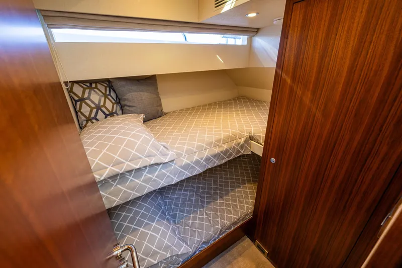 Slide: The Image of Cozy cabin interior of 2017 Ocean Alexander 72 Pilothouse yacht with wooden finishes. - 50