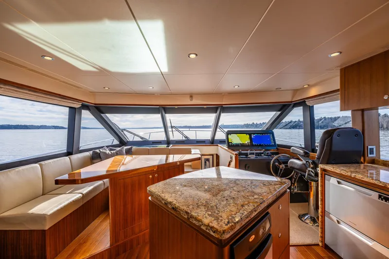 Slide: The Image of Luxurious interior of 2017 Ocean Alexander 72 Pilothouse yacht with panoramic windows and modern helm. - 53