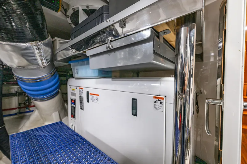 Slide: The Image of Engine room of 2017 Ocean Alexander 72 Pilothouse yacht, featuring equipment and ventilation systems. - 64