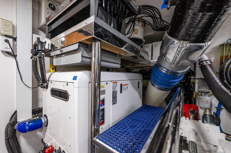 Slide: The Image of Engine room of 2017 Ocean Alexander 72 Pilothouse yacht, showcasing machinery and equipment. - 67