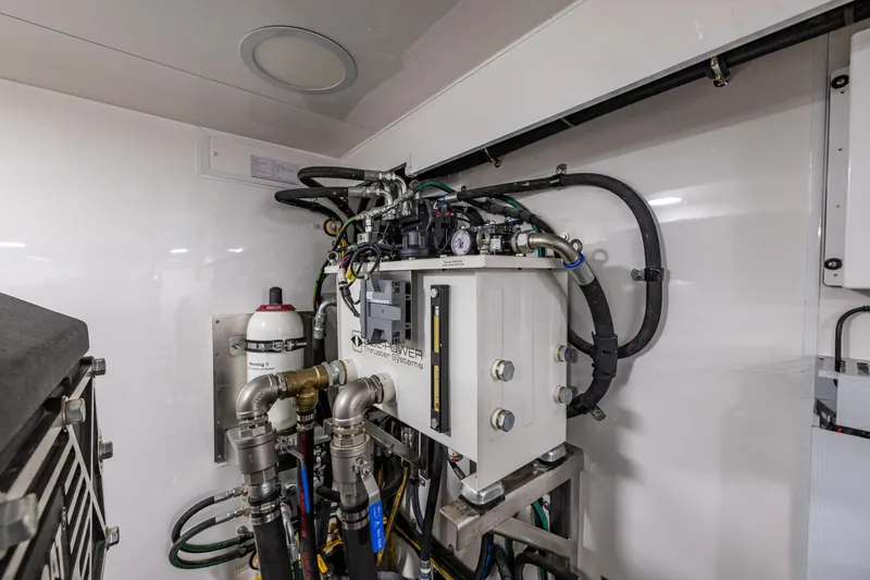 Slide: The Image of Engine room of 2017 Ocean Alexander 72 Pilothouse yacht, showcasing mechanical systems. - 70